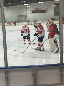 Jonathan Huberdeau and Roberto Luongo joke around while group C warms up on day 1 of Florida Panthers training camp